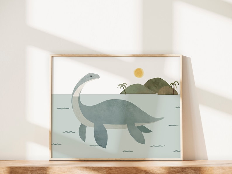 May include: A framed illustration of a blue plesiosaur swimming in a turquoise ocean with a small island in the background. The sun is shining in the sky above the island.