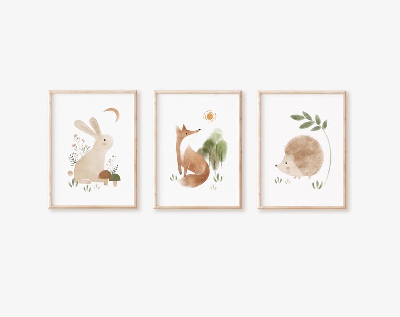 May include: Three watercolor illustrations in wooden frames, each featuring a different woodland animal: a rabbit, a fox, and a hedgehog. The illustrations are set against a neutral background with subtle green and brown accents.