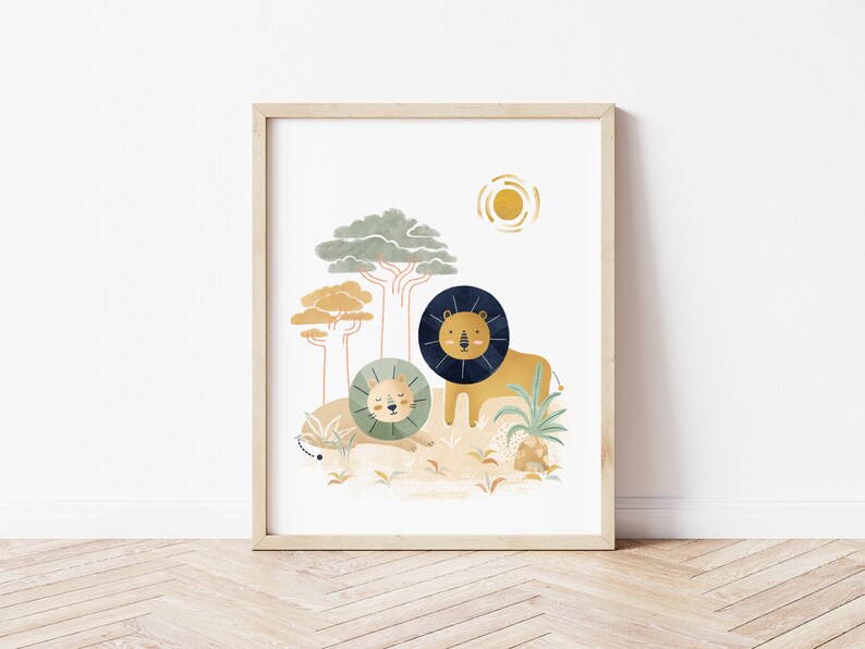 May include: A digital illustration of two lions in a jungle setting. The lions are depicted in a cartoon style with a yellow and orange background. The larger lion is standing and the smaller lion is lying down. The illustration is framed in a light wood frame.