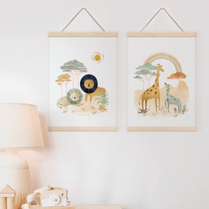 May include: Two framed prints with a nature theme. The print on the left features a lion and a lion cub in a jungle setting with a sun in the background. The print on the right features a giraffe and a baby giraffe in a jungle setting with a rainbow in the background.
