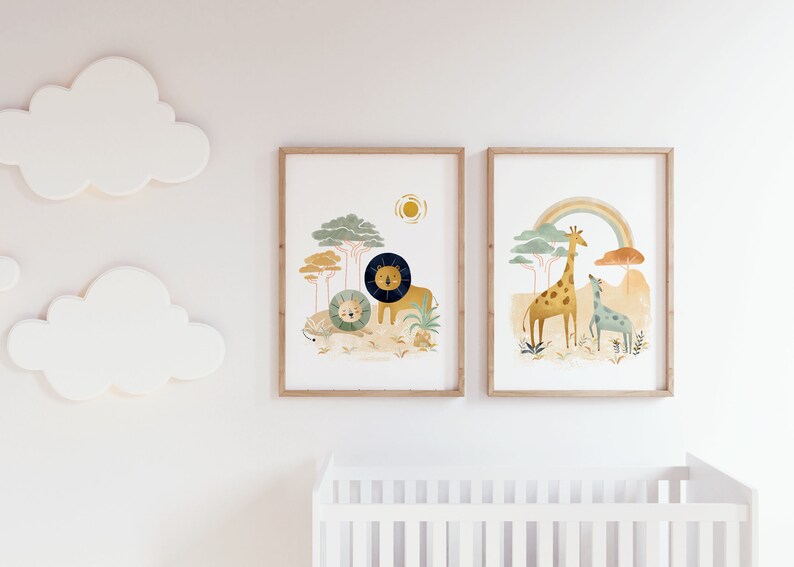 May include: Two framed illustrations of animals in a jungle setting. The first illustration features a lion and a lion cub in a green and brown jungle with a yellow sun. The second illustration features a giraffe and a smaller giraffe in a green and brown jungle with a rainbow.