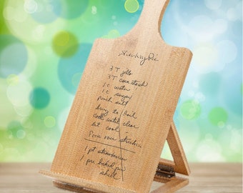 Personalized laser engraved bamboo cutting board cookbook stand/easel with your treasured handwritten recipe or note.