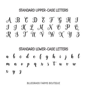 May include: A black and white image showing the standard upper and lower case letters of the English alphabet in a cursive font. The text "STANDARD UPPER-CASE LETTERS" and "STANDARD LOWER-CASE LETTERS" is also included in the image. The image is signed "BLUEGRASS FARMS BOUTIQUE".