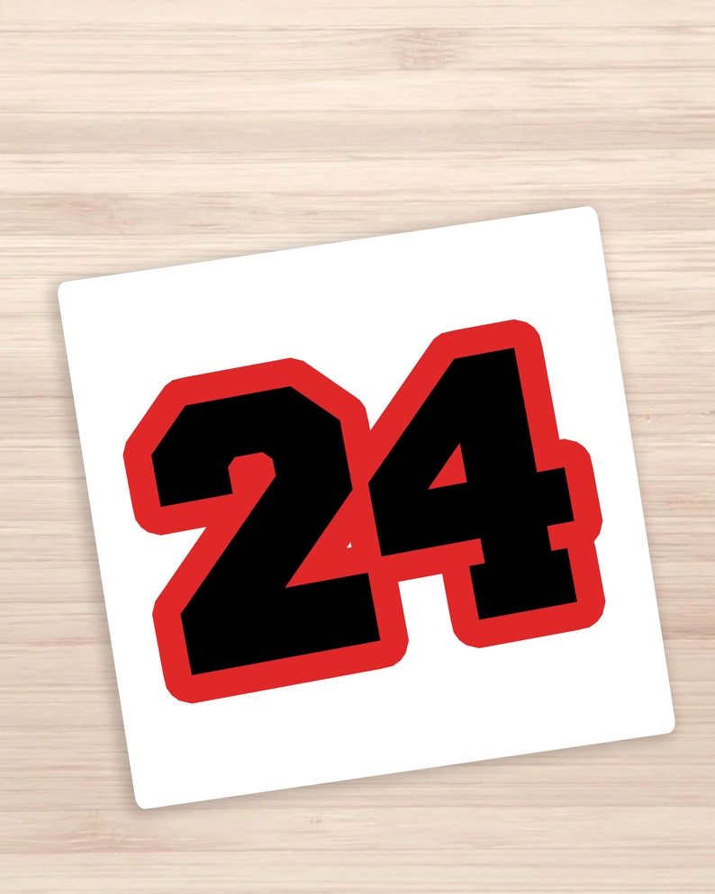 May include: A red and black number 24 sticker. The number is outlined in red and filled in black.