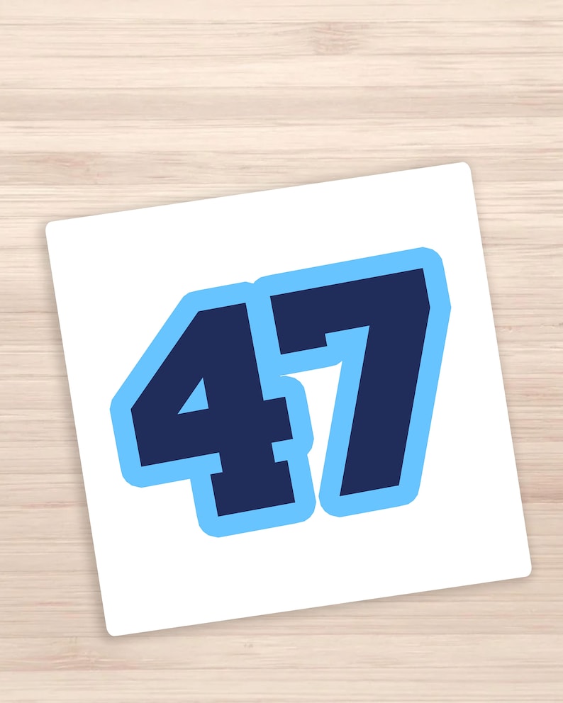 May include: A white sticker with the number 47 in bold, navy blue font with a light blue outline.