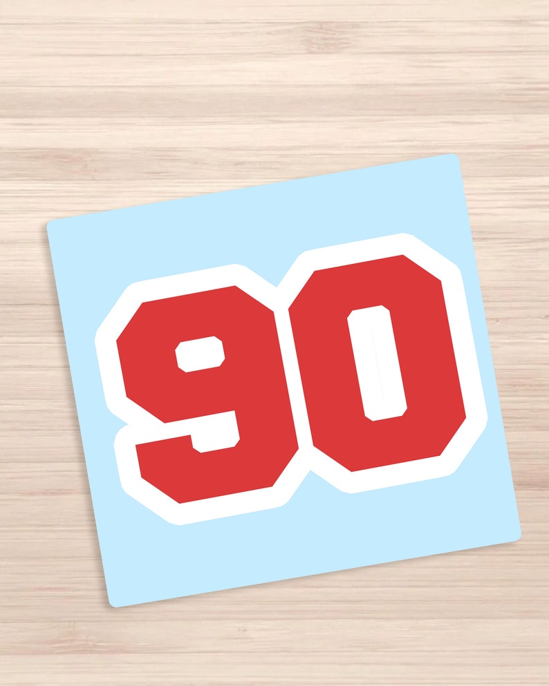 May include: Red number 90 with a white outline on a light blue background.