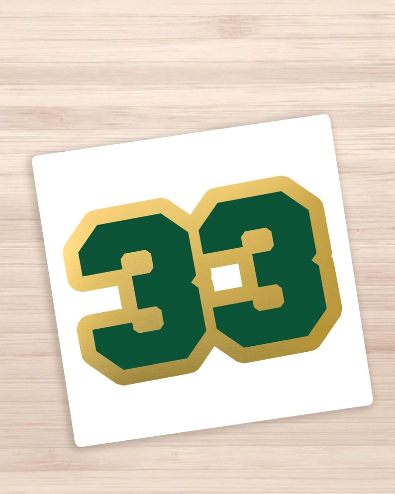 May include: A green number 33 with a gold outline. The number is in a bold, blocky font.