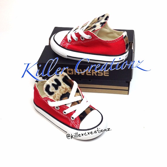 red converse with cheetah print tongue