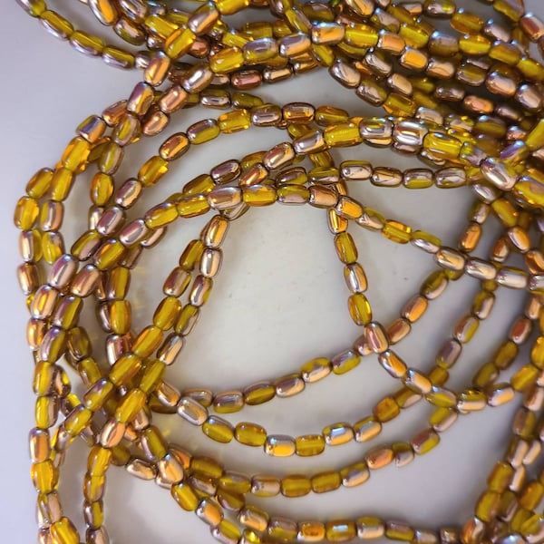 25 oval, 6x4mm, rice shape, Czech glass beads in yellow and half bronze wash