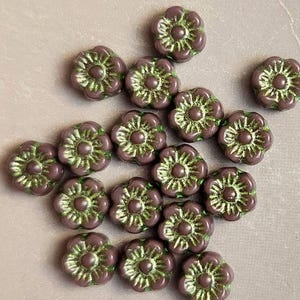 Eight 6mm Hawaii flower Czech glass beads with green metallic accent