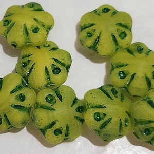 Eight 11mm green flower Czech glass beads in green