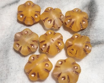 Eight 11mm flower design Czech glass beads in translucent orange