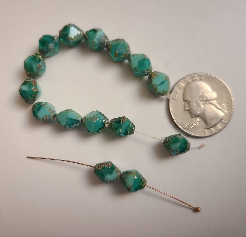 Ten Faceted 8x10mm Bicone Sea green Czech glass beads