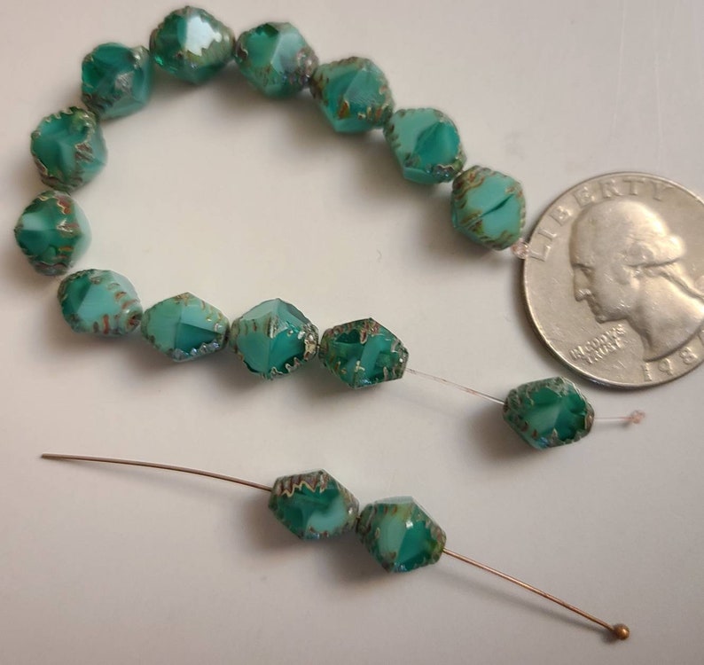 Ten Faceted 8x10mm Bicone Sea green Czech glass beads