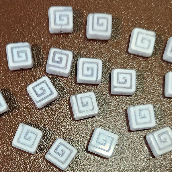 Eight 9mm square Czech glass beads with Greek Key design