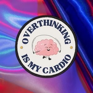 May include: A round patch with the text "OVERTHINKING IS MY CARDIO" in navy blue. A pink brain with a smiling face is jumping rope in the center. The patch has a black border and two small yellow stars.