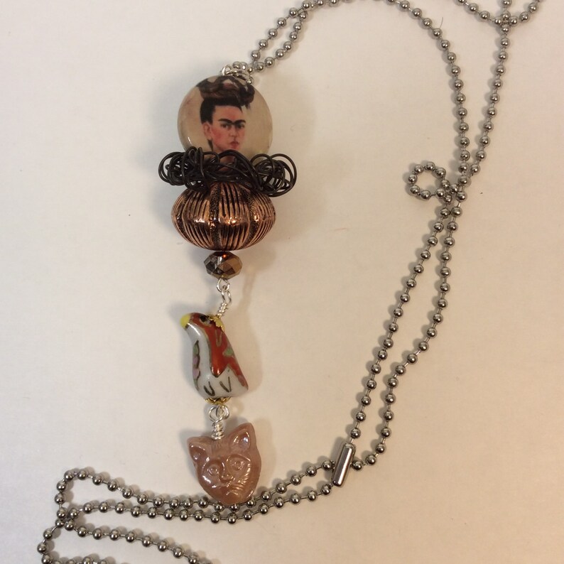 Necklace Frida Kahlo with cat and bird. Etsy