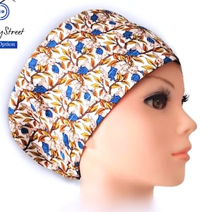 May include: A satin-lined cap with a floral pattern in blue, brown, and yellow on a white background. The cap is displayed on a mannequin head. The FifthCrafty Street logo is visible, along with the text "Satin Lined Option".