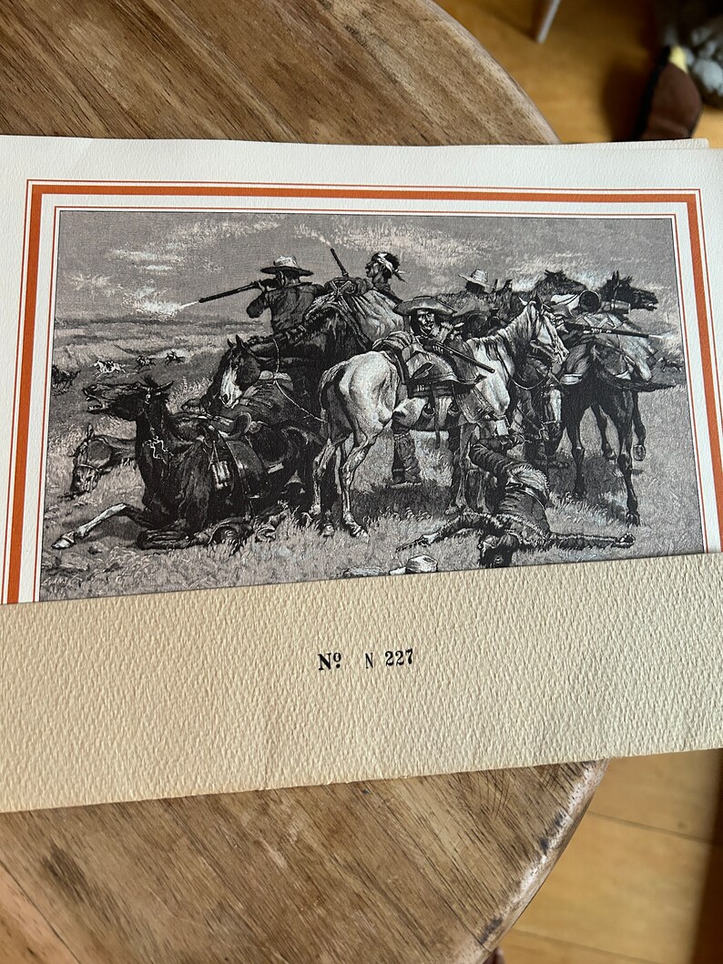May include: A black and white illustration of a group of cowboys on horseback riding through a field. The cowboys are wearing hats and carrying rifles. The image is titled "No. N 227".