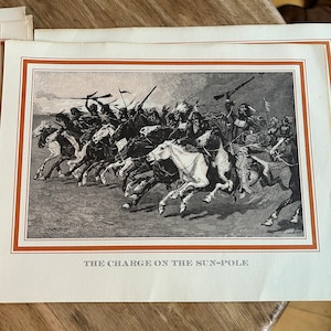 May include: A black and white illustration of a group of Native American warriors on horseback charging into battle. The image is titled "The Charge on the Sun-Pole".