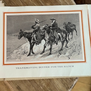 May include: A vintage Thanksgiving greeting card featuring a black and white illustration of three cowboys on horseback riding through a snowy landscape. The card has a brown border and the text "Thanksgiving Dinner for the Ranch" at the bottom.