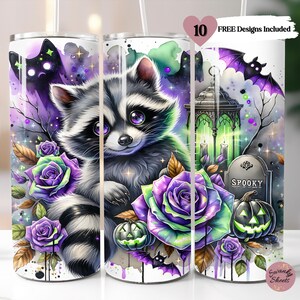 May include: A Halloween-themed tumbler featuring a raccoon with purple eyes, surrounded by purple and green roses, bats, and jack-o'-lanterns. The design includes a spooky graveyard scene with the word "Spooky" on a tombstone. The text "10 FREE Designs Included" is also visible.