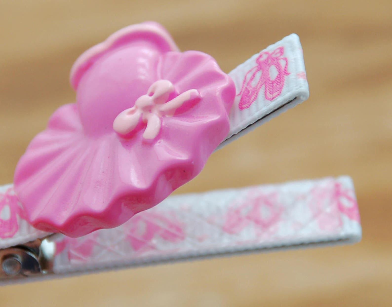 girls barrette fully lined on a double prong alligator clip in white grosgrain with pink ballet slipper and pink tutu embellishm
