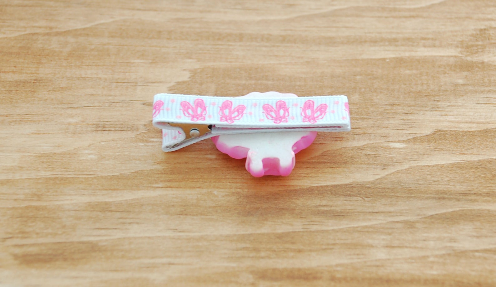 girls barrette fully lined on a double prong alligator clip in white grosgrain with pink ballet slipper and pink tutu embellishm