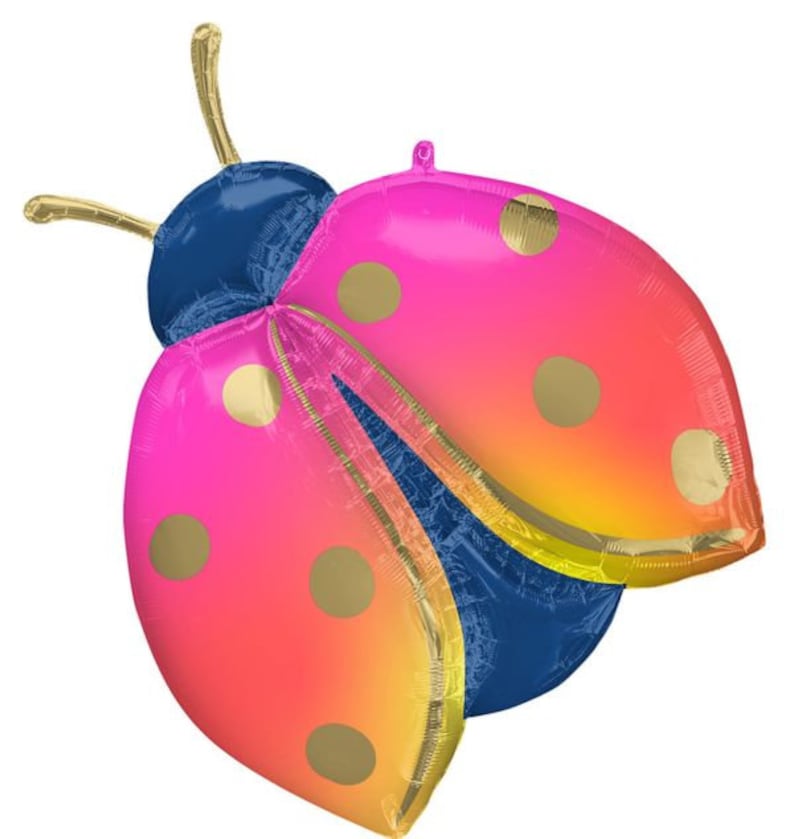 May include: A large, colorful ladybug-shaped balloon. The balloon features pink and orange wings with gold polka dots, a dark blue body, and gold antennae. The balloon is designed for festive occasions.