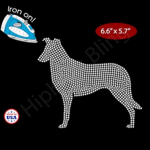 May include: A rhinestone dog design, 6.6" x 5.7", on a black background. The dog is made of white rhinestones. Includes a blue iron and a "Made in USA" graphic. The text "Iron on!" is also present.