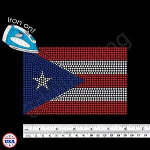 May include: Iron-on rhinestone design of the Puerto Rican flag, featuring red, white, and blue rhinestones. The design is approximately 6 inches wide. Includes the text "Iron on!" and a blue iron graphic. Made in the USA.