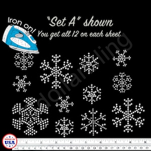 May include: Black background with a collection of white snowflake designs. The text "Set A shown" and "You get all 12 on each sheet" are visible. An iron is shown in the upper left corner. A ruler is at the bottom.