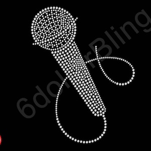 May include: A white rhinestone microphone design on a black background. The microphone is made of small, round rhinestones. The design includes a cord that loops around. The words "6dollarBling" are in the background. A "Made in USA" sticker is in the lower left corner.