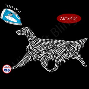 May include: White rhinestone dog design, 7.6" x 4.5", on a black background. Includes a blue iron and the text "Iron on!". The design is made in the USA. Perfect for apparel and accessories.