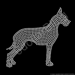 May include: A rhinestone dog silhouette on a black background. The dog is depicted in profile, with its body and features outlined by numerous small, sparkling rhinestones. The design is a decorative element.