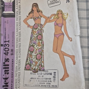 May include: Vintage McCall's 4031 sewing pattern for a Misses' bikini swimsuit and skirt. The pattern envelope features illustrations of the bikini and skirt, with floral and solid color options. The envelope is marked with the size 10 and bust 32 1/2 inches.
