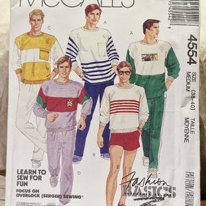 May include: A McCall's 4554 sewing pattern envelope for size medium (38-40) featuring illustrations of five different sweatshirt and pant or short combinations. The text includes "McCall's", "4554", "Fashion Basics", and "Learn to sew for fun".