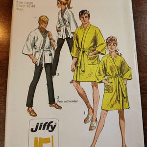 May include: Vintage Simplicity sewing pattern featuring illustrations of people wearing robes. The pattern includes a size large for chests 42-44 inches. The pattern is labeled "Jiffy" and includes four main pattern pieces. The text "easy cut easy sew" is also visible.