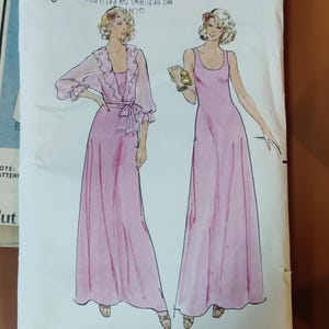 May include: A vintage sewing pattern envelope featuring illustrations of two pink dresses. The envelope reads "Buuenck Instant Fashion Patterns" and includes the size "8". The text "DRESS SIZED FOR MODERATE STRETCH KNITS ONLY" is also visible.
