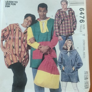 May include: A sewing pattern for three hooded tops. The pattern is for sizes X-Small, Small, and Medium. The pattern number is 6476.