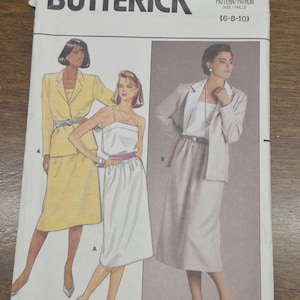 May include: A Butterick sewing pattern featuring illustrations of women's suits and dresses. The pattern includes a yellow skirt suit, a white dress with a pink belt, and a gray skirt suit. The pattern number is 3116.