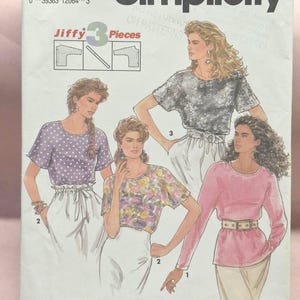 May include: Simplicity sewing pattern 7632 featuring three pieces. The pattern includes illustrations of various tops, including a polka-dot top, floral top, and long-sleeved top. The pattern size is NN (10-16).