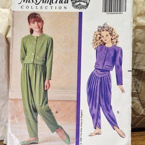 May include: Butterick pattern 5013 from The Miss America Collection, size 7-8-10. The envelope features illustrations of two outfits: a green jacket with matching trousers, and a purple jacket with a draped, wrap-style pant design.