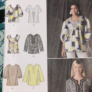 May include: A sewing pattern for six different tops. The tops are all variations of a loose-fitting, V-neck style with different sleeve lengths and necklines. The pattern includes a black and white zebra print top, a yellow and black geometric print top, a floral print top, a solid white top, a solid brown top, and a solid yellow top.