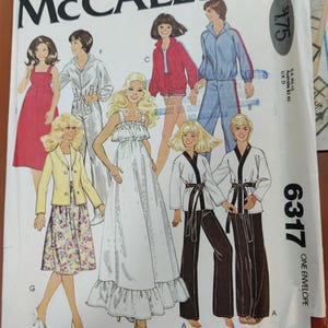 May include: A vintage McCall's sewing pattern envelope featuring five different clothing designs. The pattern is for size 15 and is titled "Carefree Patterns from McCall's".