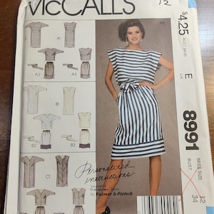 May include: McCall's sewing pattern envelope showing a woman in a blue and white striped dress. The envelope includes illustrations of different garment styles and the text "Personalised instructions". The pattern is size 12.