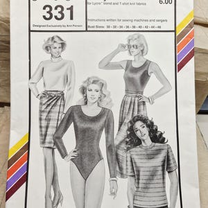 May include: A Stretch & Sew 331 sewing pattern envelope for bodysuit T's, designed by Ann Person. The white paper cover features black and white illustrations of four outfits, including a long-sleeve bodysuit, a t-shirt, and skirts. Text includes bust sizes 30-46 and copyright 1993.