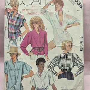 May include: Vintage McCall's sewing pattern envelope featuring illustrations of women's shirts. The cover displays various shirt styles in different colors and patterns, with the number 2038 and size 16 visible.