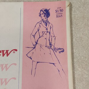 May include: A vintage sewing pattern featuring a woman wearing a blue jacket and skirt with a beret. The pattern is on a pink background with the text "U.S.A. $1.50 CANADA $1.65".