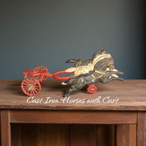 vintage cast iron horses with cart